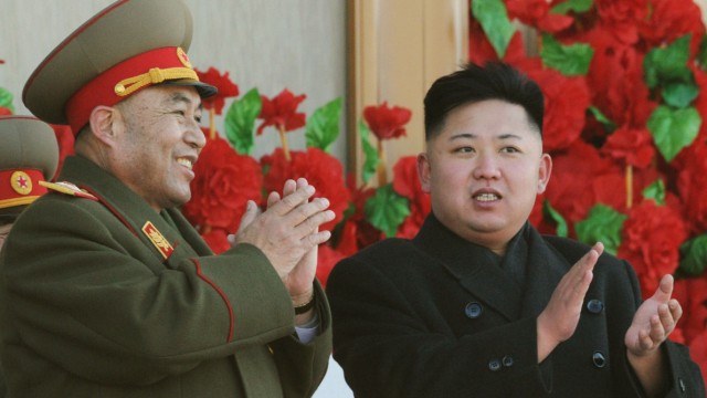 File photo of North Korean leader Kim Jong-Un exchanging smiles with chief of general staff of the Korean People's Army Ri Yong-ho during a military parade in Pyongyang