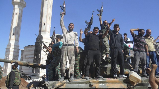 Members of the Free Syrian Army chant slogans against Syrian President Bashar al-Assad in Azzaz, Aleppo province