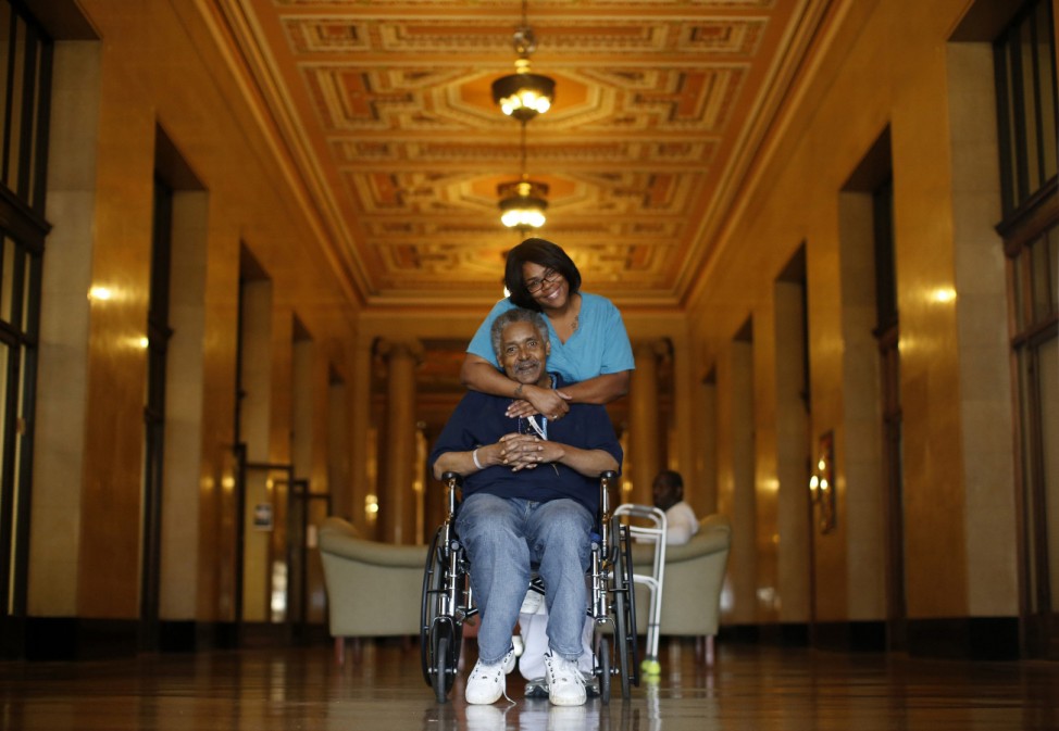 An HIV/AIDS patient poses with a nurse at the Broadway House for Continuing care in Newark
