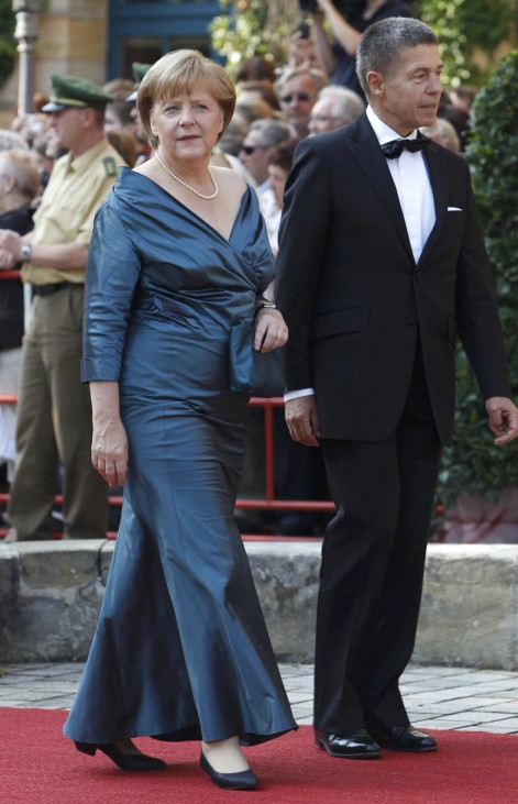 German Chancellor Merkel and her husband Sauer arrive for opening of Bayreuth Wagner opera festival in Bayreuth