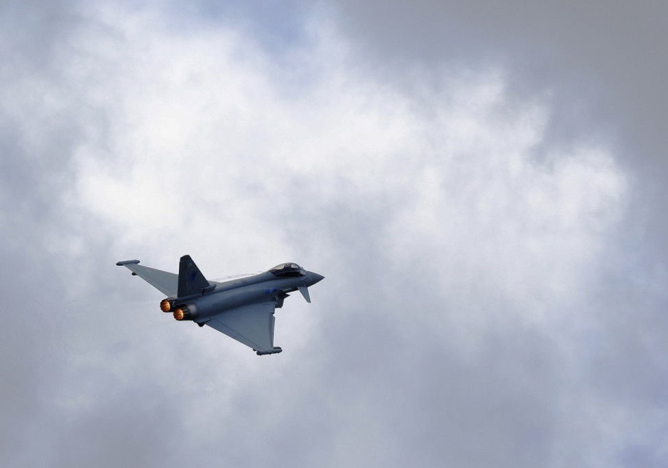 A Eurofighter Typhoon performs a display flight at the Farnborough Airshow 2012 in southern England