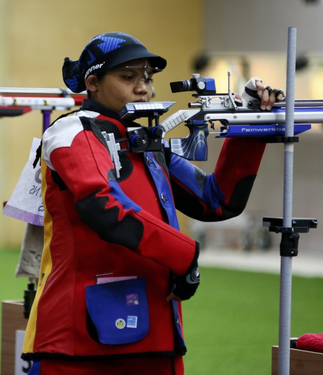 Malaysia's Nur Suryani Mohd Taibi prepares before the women's 10m air rifle qualification competition at the London 2012 Olympic Games in the Royal Artillery Barracks at Woolwich in London
