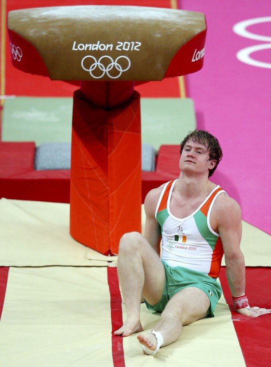 Kieran Behan of Ireland reacts after falling from the vault at the men's gymnastics qualification during the London 2012 Olympic Games