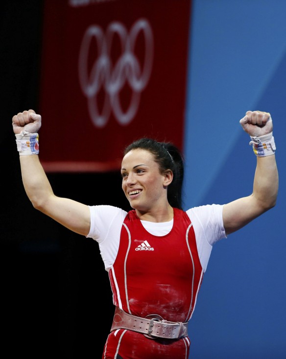 Moldova's Cristina Iovu reacts after successful lift on the women's 53Kg Group A weightlifting competition at the London 2012 Olympic Games