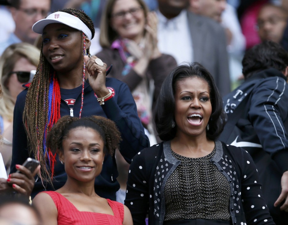 U.S. first lady Obama, tennis player Venus Williams and former gymnast Dawes react after Serena Williams of the U.S. defeated Serbia's Jankovic in their women's singles tennis match at the All England Lawn Tennis Club during the London 2012 Olympics Games
