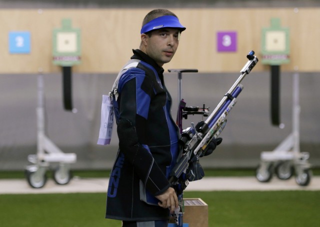 Romania's Alin George Moldoveanu looks on during the 10m air rifle men's finals at the Royal Artillery Barracks during the London 2012 Olympic Games