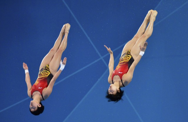 China's Wang Hao and Chen Ruolin perform a dive during the women's synchronised 10m platform final at the London 2012 Olympic Games