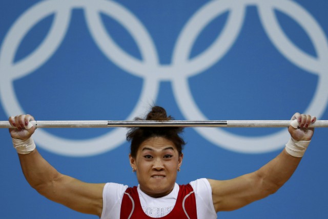 Kazakhstan's Maiya Maneza competes on the women's 63Kg weightlifting competition at the ExCel venue at the  London 2012 Olympic Games