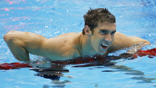 Michael Phelps of the U.S. smiles after winning his 19th Olympic medal in the men's 4x200m freestyle relay final during the London 2012 Olympic Games at the Aquatics Centre
