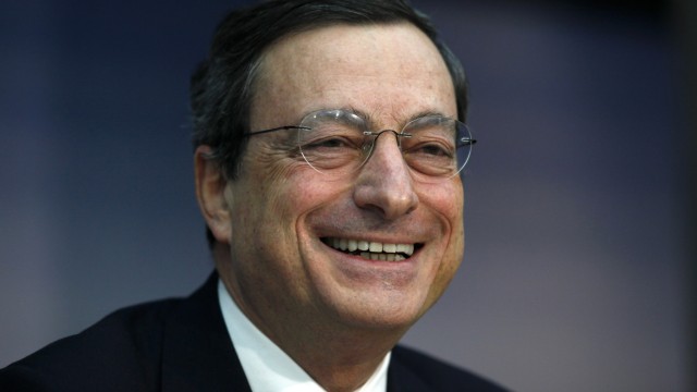 File photo shows ECB President Draghi smiling during the monthly news conference in Frankfurt