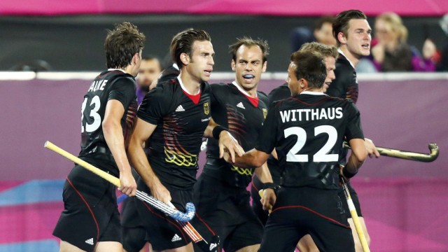 Germany's Zeller celebrates with his teammates after scoring a goal against South Korea during their men's Group B hockey match at the London 2012 Olympic Games at the Riverbank Arena on the Olympic Park