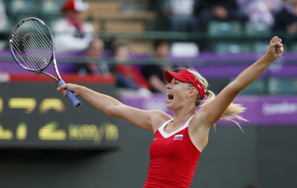 Russia's Sharapova celebrates after defeating Germany's Lisicki in their women's singles tennis match at the All England Lawn Tennis Club during the London 2012 Olympic Games