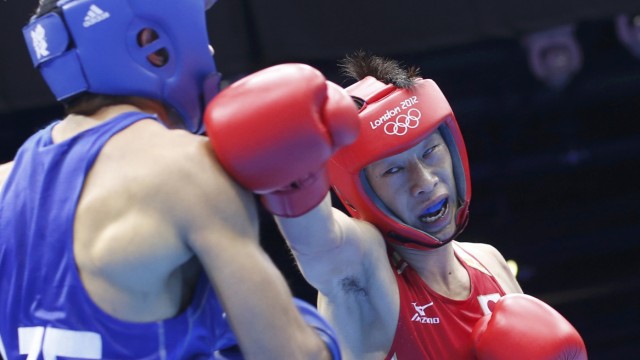 Japan's Shimizu fights against Azerbaijan's Abdulhamidov in their Men's Bantam (56kg) Round of 16 boxing match during the London 2012 Olympic Games