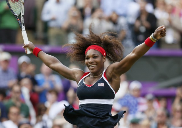Serena Williams of the U.S. celebrates after winning the women's singles gold medal match against Russia's Sharapova at the All England Lawn Tennis Club during the London 2012 Olympic Games