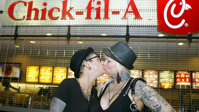 Ally Wells and Heather Michelle, participate during the nationwide 'kiss-in'  at a Chick-Fil-A restaurant in the CNN center in Atlanta.