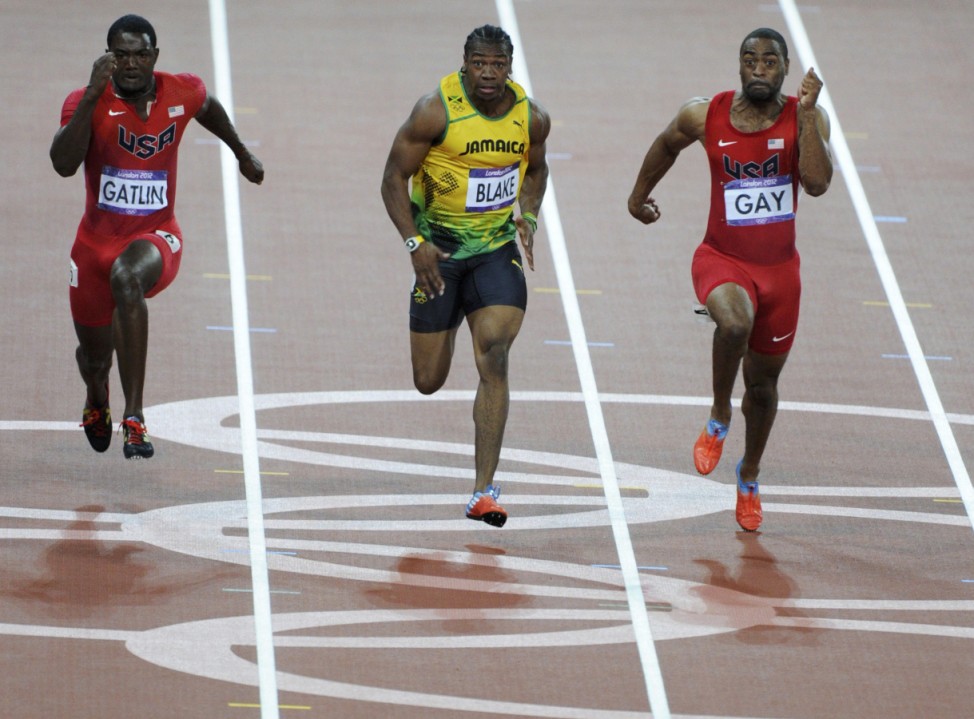 Justin Gatlin of the U.S., Jamaica's Yohan Blake and Tyson Gay of the U.S. compete in the men's 100m final during the London 2012 Olympic Games