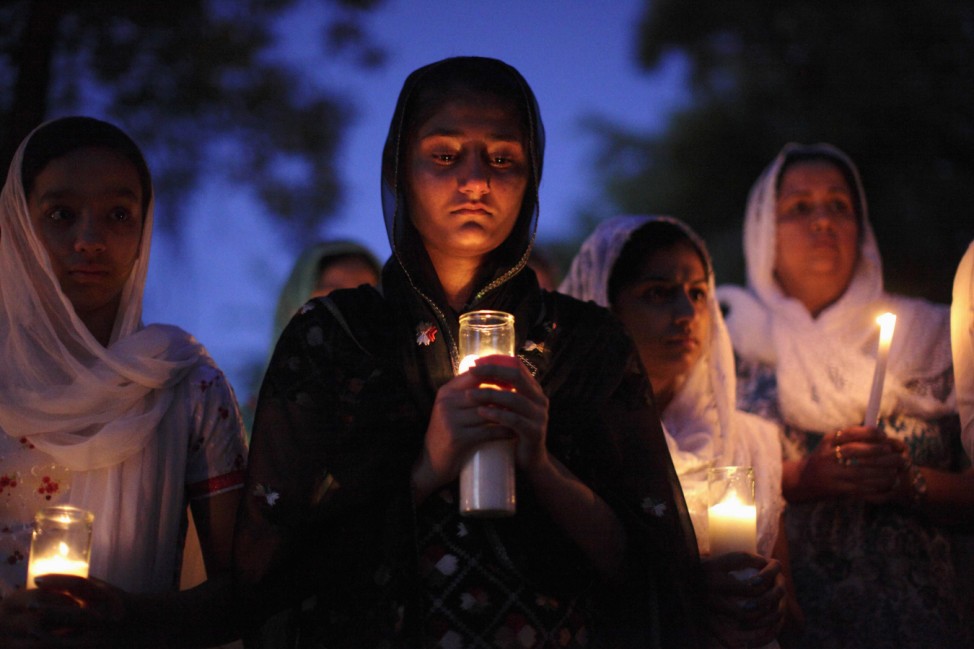 Mourners attend a candlelight vigil at the Sikh temple in Brookfield