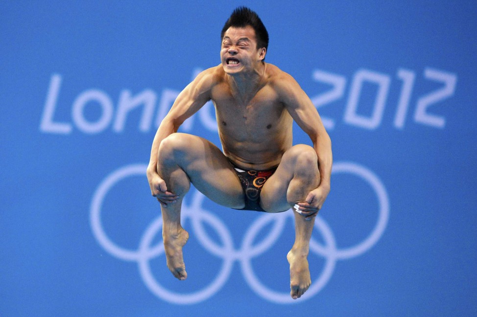 China's He Chong performs a dive during the men's 3m springboard semi-final at the London 2012 Olympic Games at the Aquatics Centre