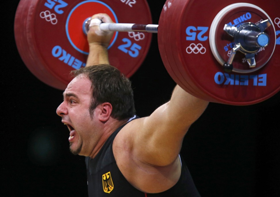 Germany's Almir Velagic competes in the men's +105kg Group A snatch weightlifting competition during the London 2012 Olympic Games