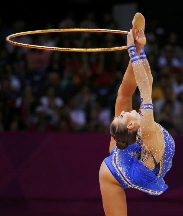 Russia's Evgeniya Kanaeva competes using the hoop in her individual all-around gymnastics qualification match during the London 2012 Olympic Games