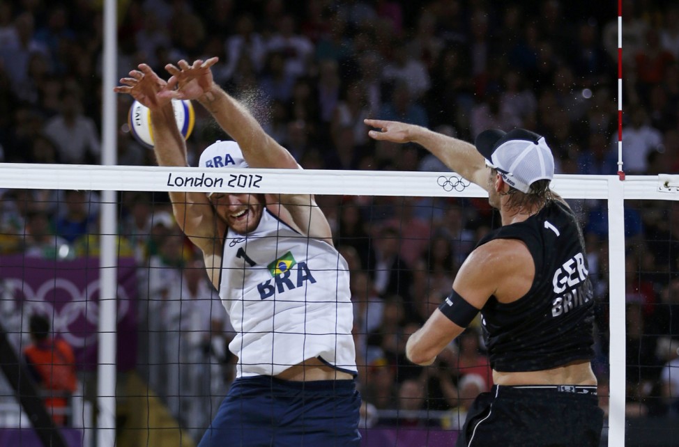 Germany's Julius Brink spikes against Brazil's Alison during their men's beach volleyball gold medal match at the London 2012 Olympic Games