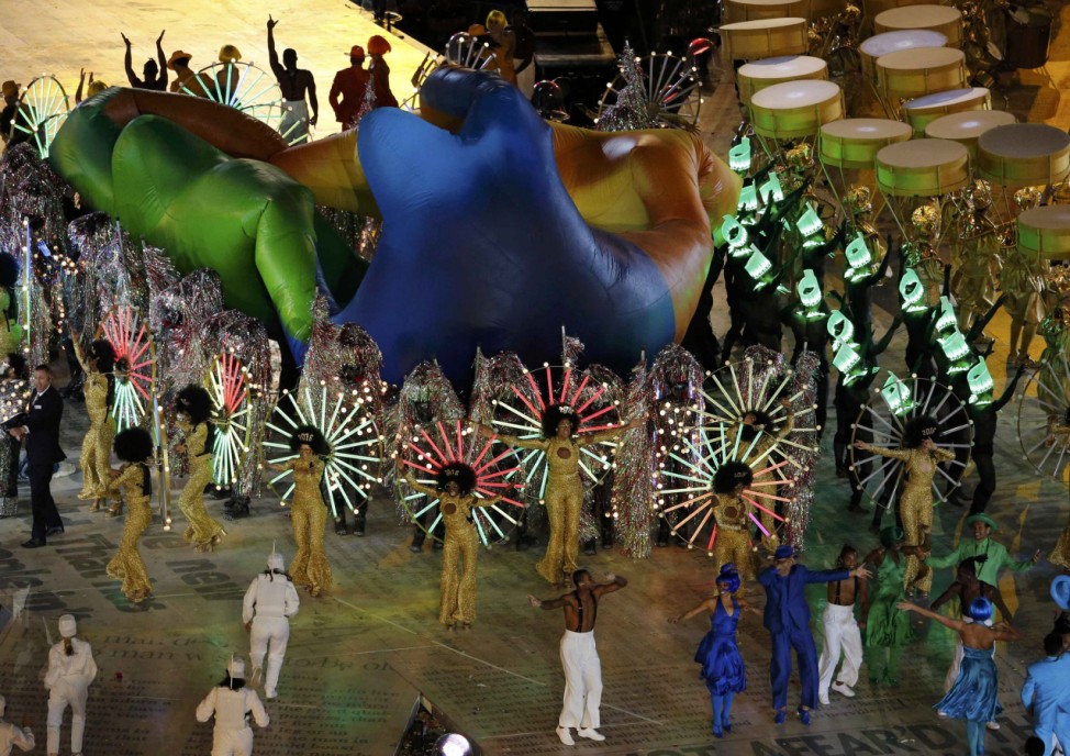 Performers take part in the closing ceremony of the London 2012 Olympic Games at the Olympic Stadium