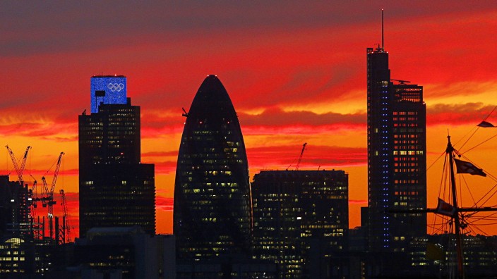 Sunset is seen behind the city of London