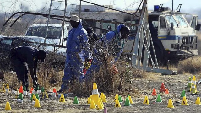 Forensic Unit Police investigates the scene where striking miners