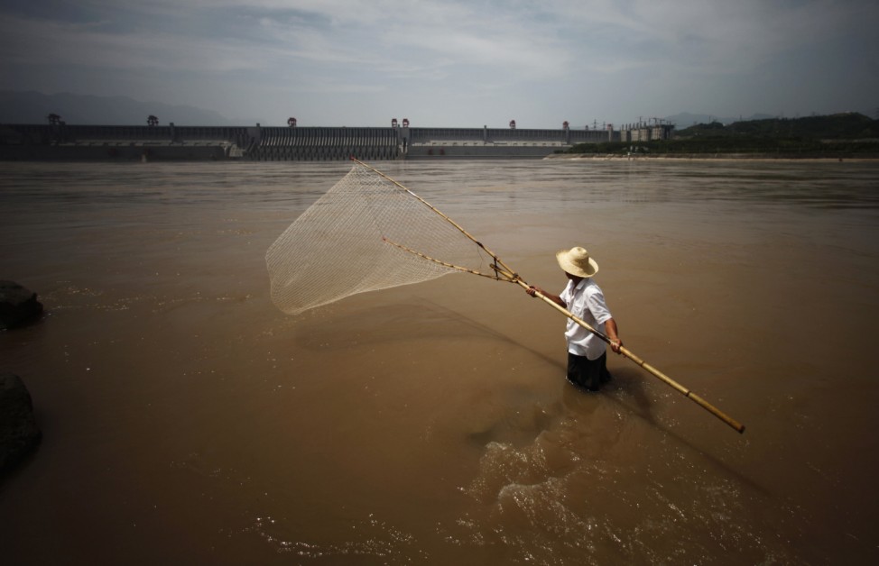 Man fishes at the Yangtze River near the Three Gorges dam in Yichang