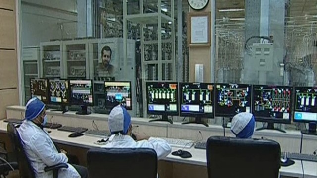 Still image taken from video shows workers in what is described by Iranian state television as an enrichment control room at a facility in Natanz