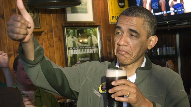 Obama gives a thumbs-up as he celebrates St. Patrick's Day in Washington