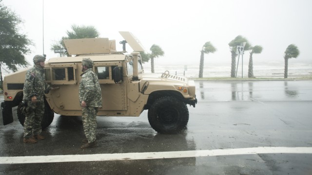 The Mississippi Army National Guard  keeps people off the streets during curfew along Beach Blvd. as Hurricane Isaac passes through Gulfport