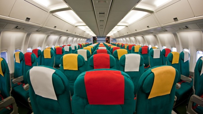 Photo of the passenger cabin of a commercial airliner.