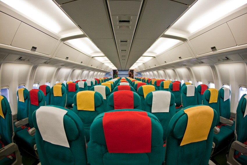 Photo of the passenger cabin of a commercial airliner.