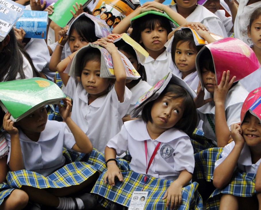 Students participate in a earthquake drill in Manila