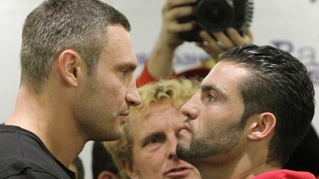WBC heavyweight champion Vitali Klitschko of Ukraine and Manuel Charr of Germany pose during the official weigh-in in Moscow