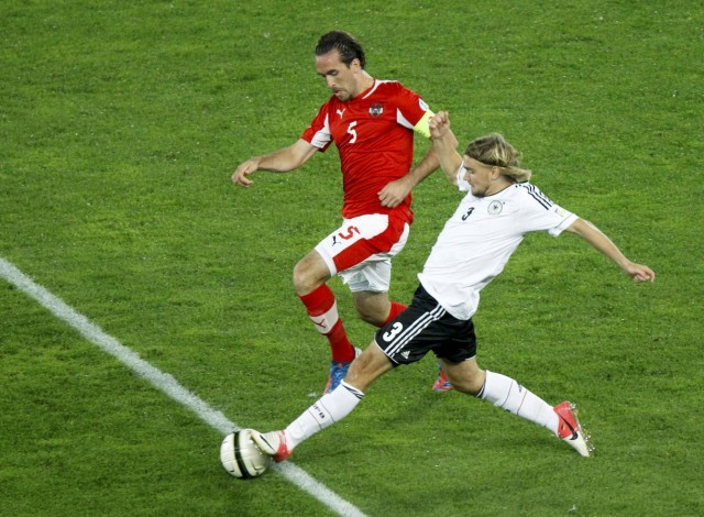 Austria's Fuchs challenges Germany's Schmelzer during their 2014 World Cup qualifying soccer match in Vienna