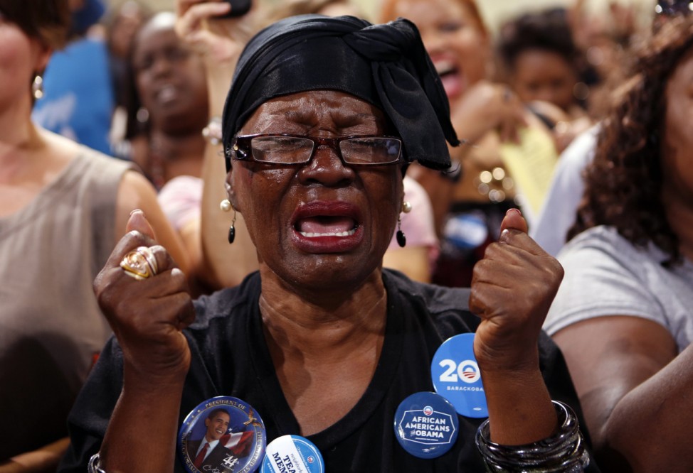 Mona Renee Johnson becomes emotional as U.S. President Barack Obama speaks at a campaign rally in Las Vegas