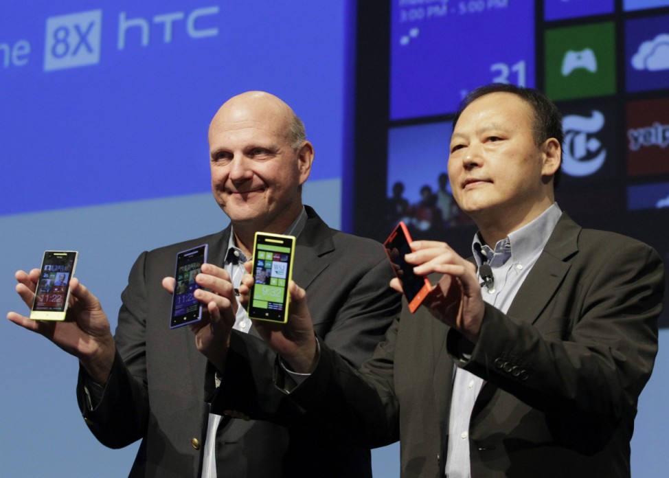 Microsoft CEO Ballmer and HTC CEO Chou display new Microsoft Windows 8 operating system phones at a launch event in New York