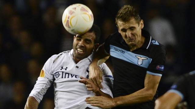 Tottenham Hotspur's Sandro challenges Lazio's Klose during their Europa League soccer match at White Hart Lane in London