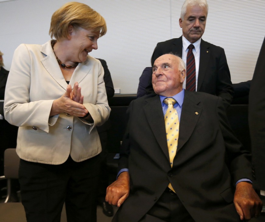 German Chancellor Merkel and former German chancellor Kohl arrive for a CDU and CSU party faction meeting in Berlin