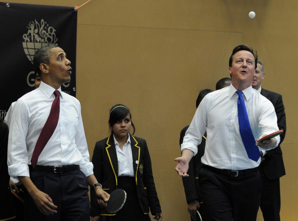 U.S. President Barack Obama and Britain's Prime Minister David Cameron play table tennis at Globe Academy, in south London