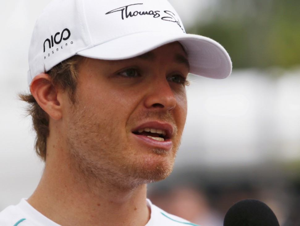 Mercedes Formula One driver Rosberg of Germany speaks to journalists in the paddock before the Singapore F1 Grand Prix