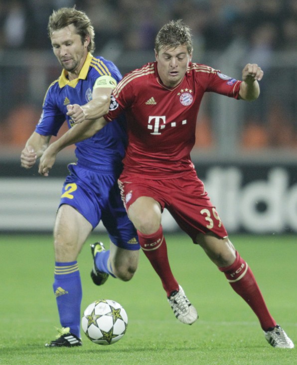 BATE Borisov's Likhtarovich fights for the ball with Bayern Munich's Kroos during their Champion's League Group F soccer match in Minsk's Dinamo Stadium