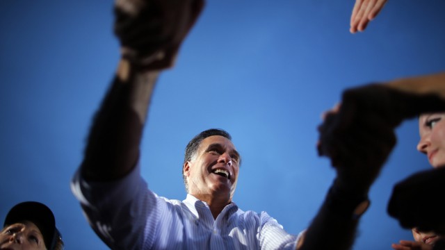 Republican presidential nominee Romney greets audience members at a campaign rally in St. Petersburg