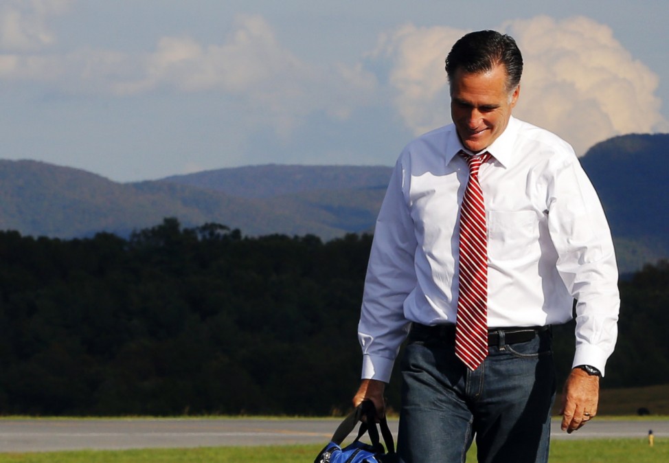 Republican presidential nominee Mitt Romney gets off his campaign plane at the airport in Weyers Cave