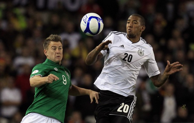 Germany's Jerome Boateng challenges Ireland's Simon Cox during the 2014 World Cup qualifying soccer match at the Aviva Stadium in Dublin