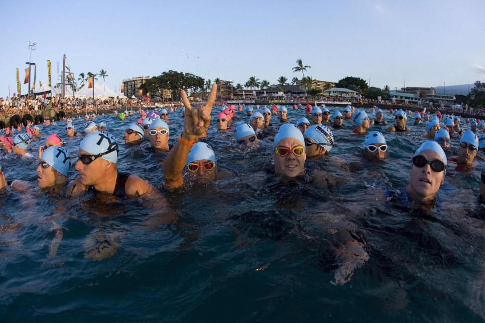 Amateur competitors wait for the start of the 2.4 mile swim portion of the Ironman World Championship triathlon in Kailua-Kona, Hawaii