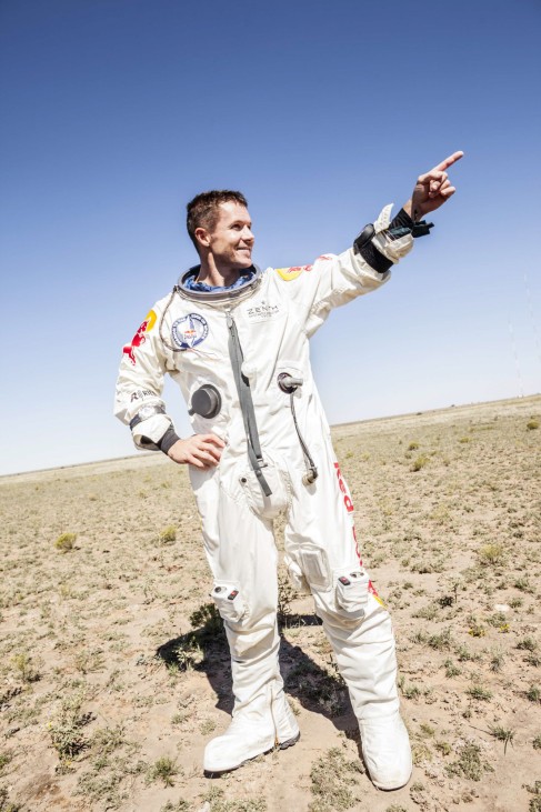 Handout of pilot Felix Baumgartner of Austria celebrating after successfully completing the final manned flight for Red Bull Stratos in Roswell
