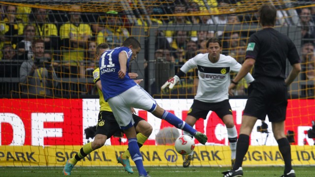 Schalke 04's Afellay scores a goal against Borussia Dortmund during their German first division Bundesliga soccer match in in Dortmund